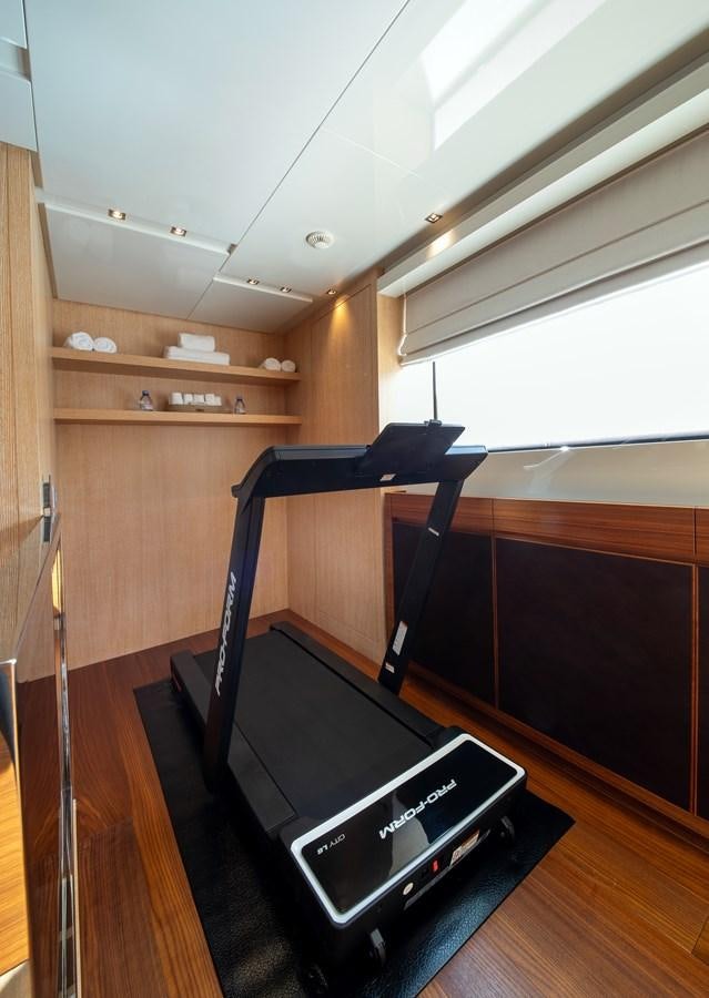 a treadmill in a room aboard CYBELE Yacht for Sale
