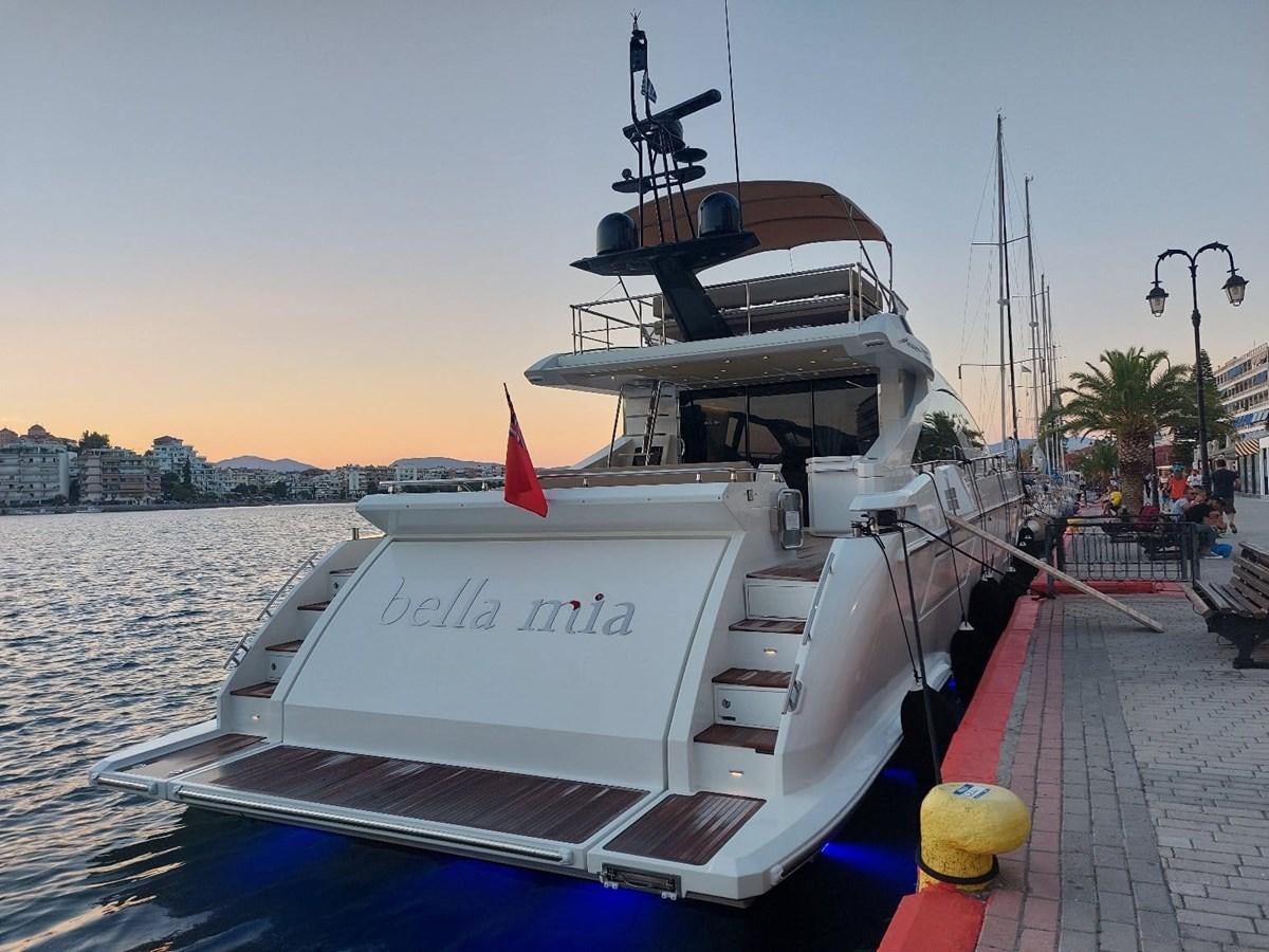 a boat docked at a pier aboard BELLA MIA Yacht for Sale