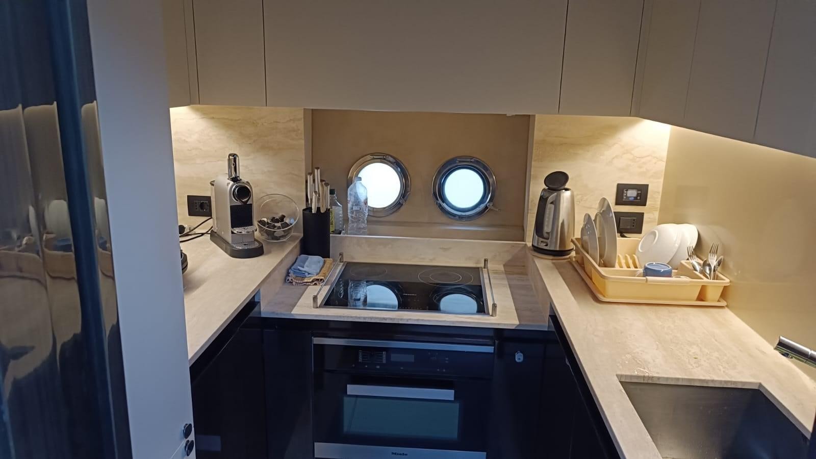 a kitchen with a sink and a mirror aboard BELLA MIA Yacht for Sale
