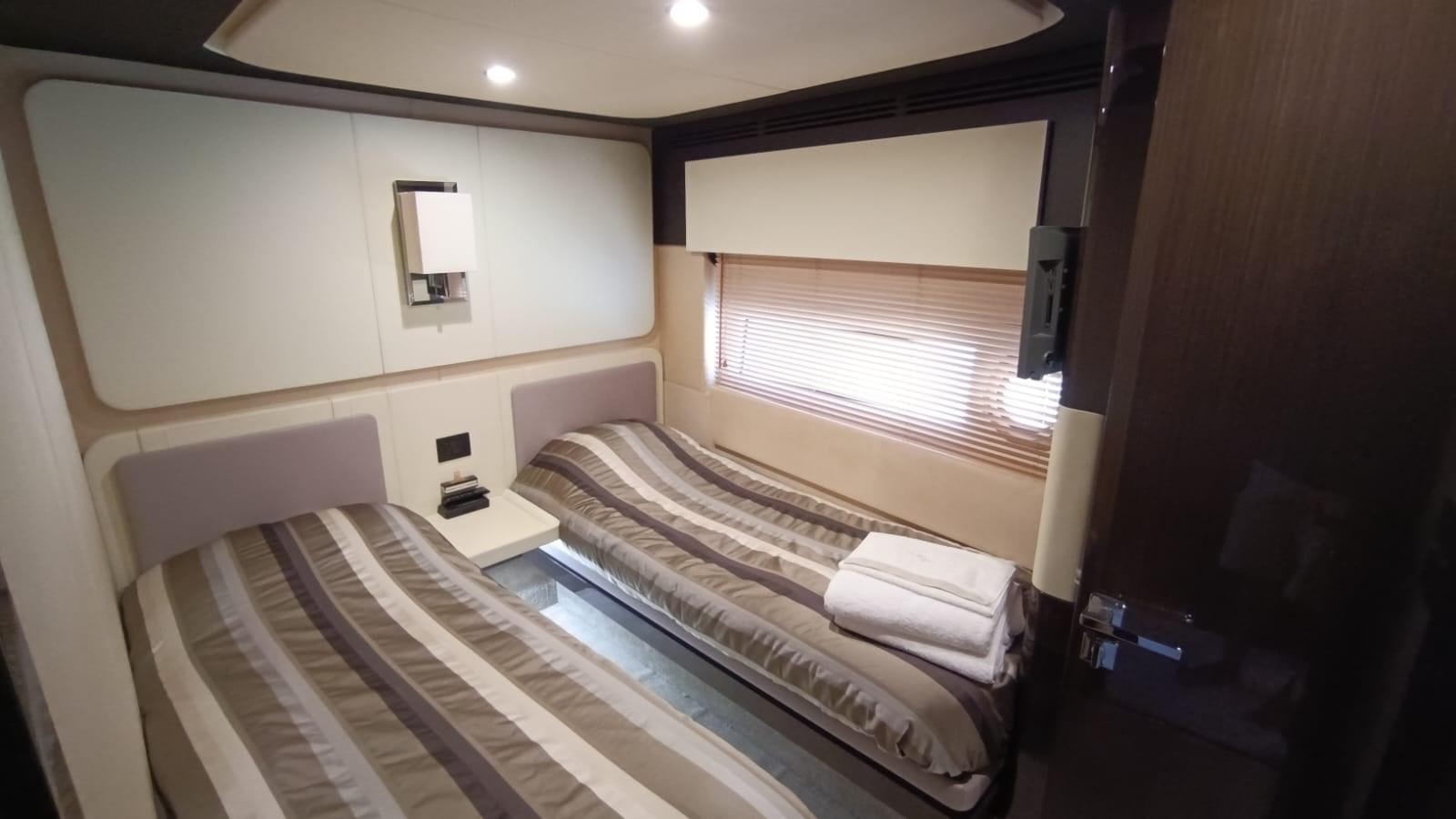 a room with a bed and a window aboard BELLA MIA Yacht for Sale