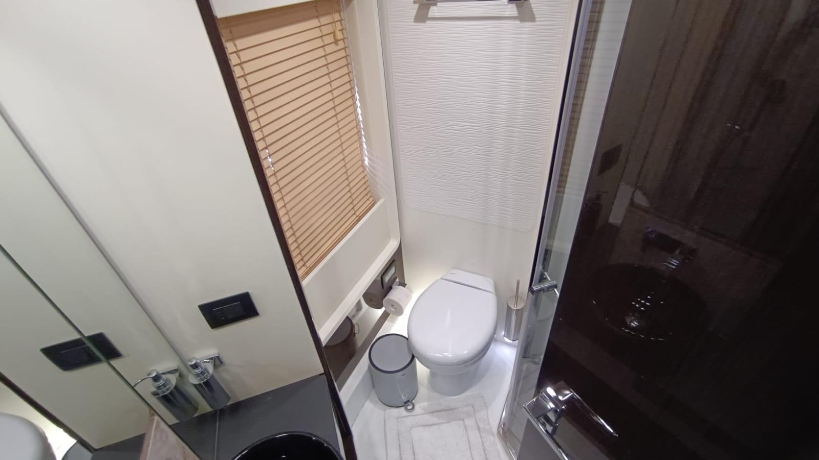 a bathroom with a tub and toilet aboard BELLA MIA Yacht for Sale
