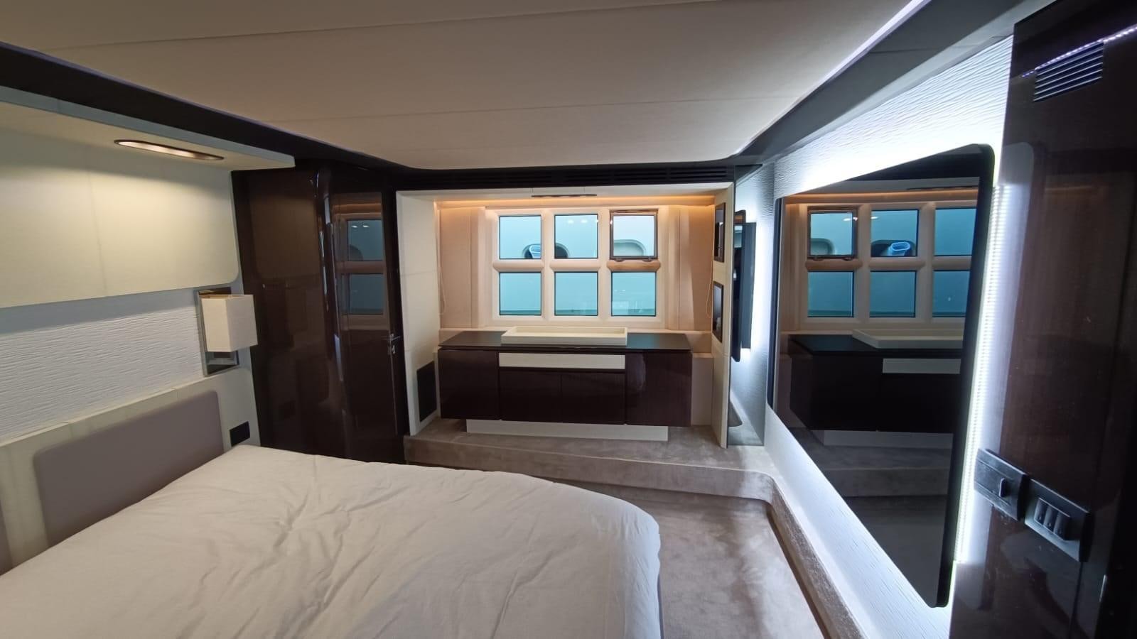 a room with a bed and a door aboard BELLA MIA Yacht for Sale