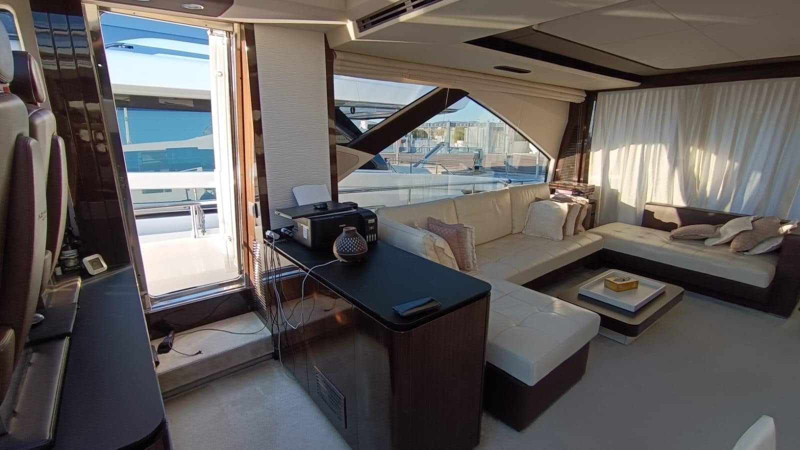 a room with a couch and a table aboard BELLA MIA Yacht for Sale