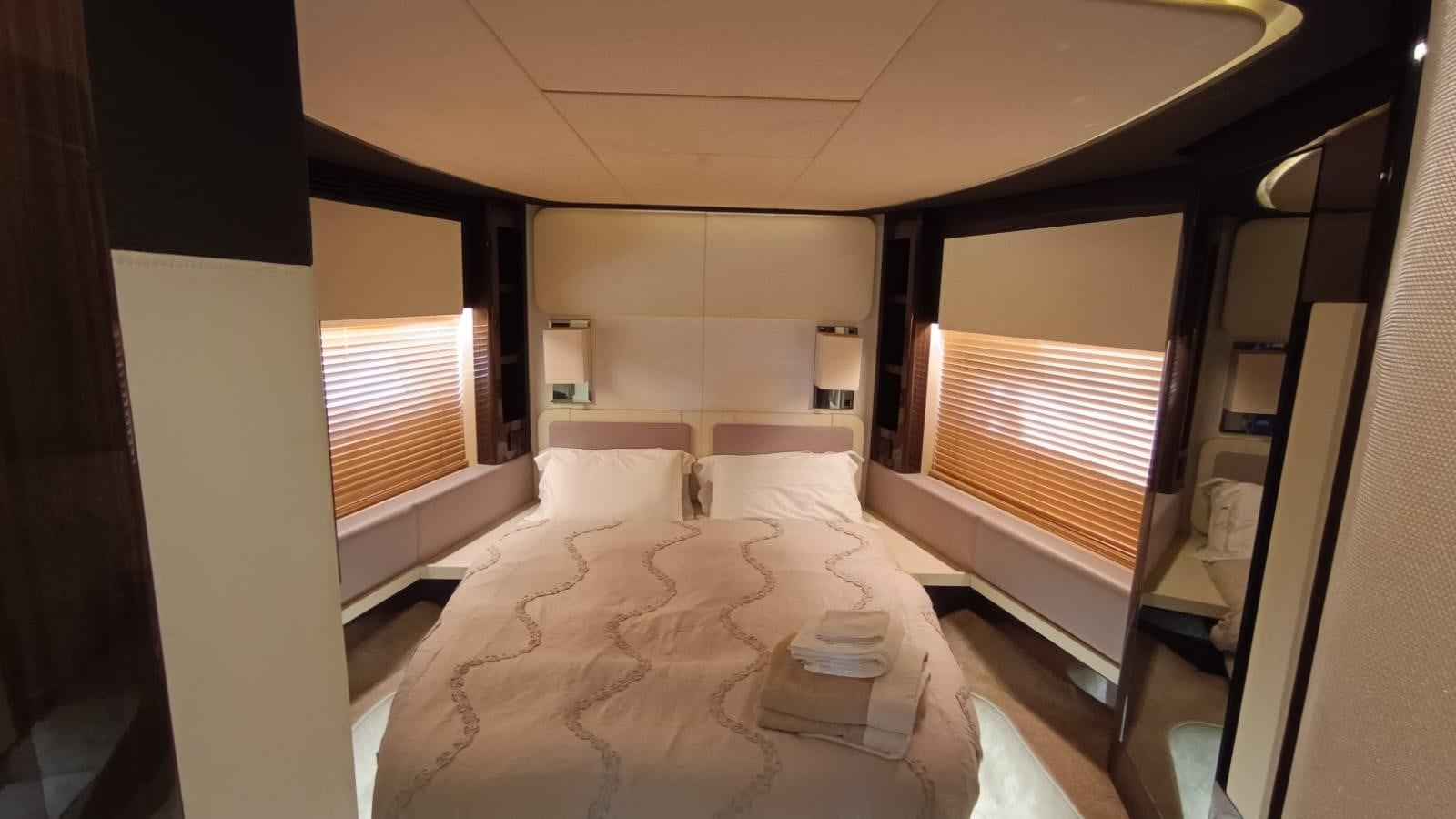 a room with a bed and a window aboard BELLA MIA Yacht for Sale