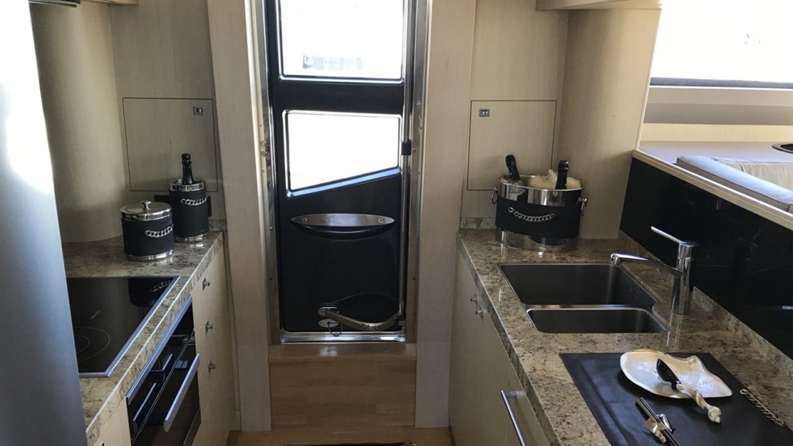 a kitchen with a sink and a stove aboard MS FELICE Yacht for Sale