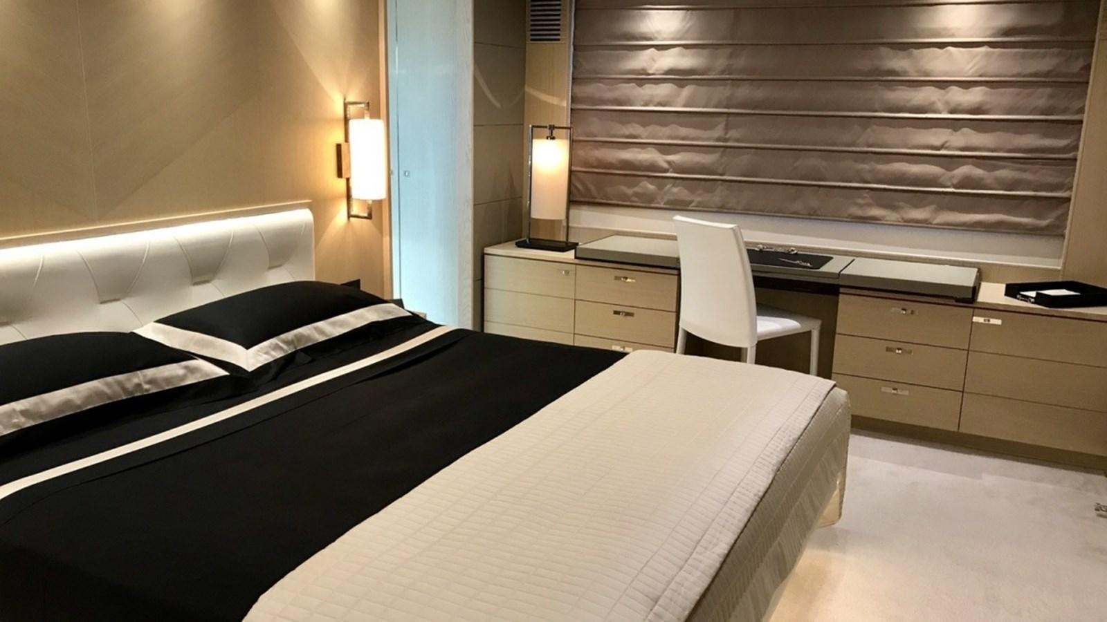 a room with a bed and desk aboard MS FELICE Yacht for Sale