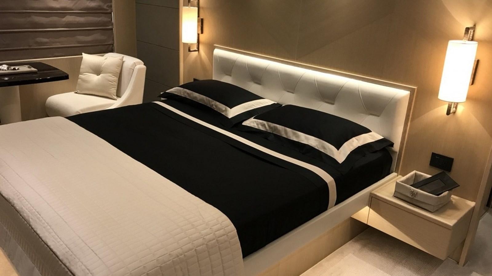 a hotel room with a bed and a desk aboard MS FELICE Yacht for Sale