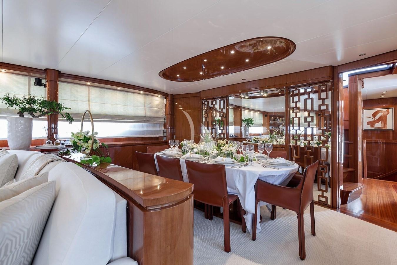 a dining room with a table and chairs aboard SL88 Yacht for Sale