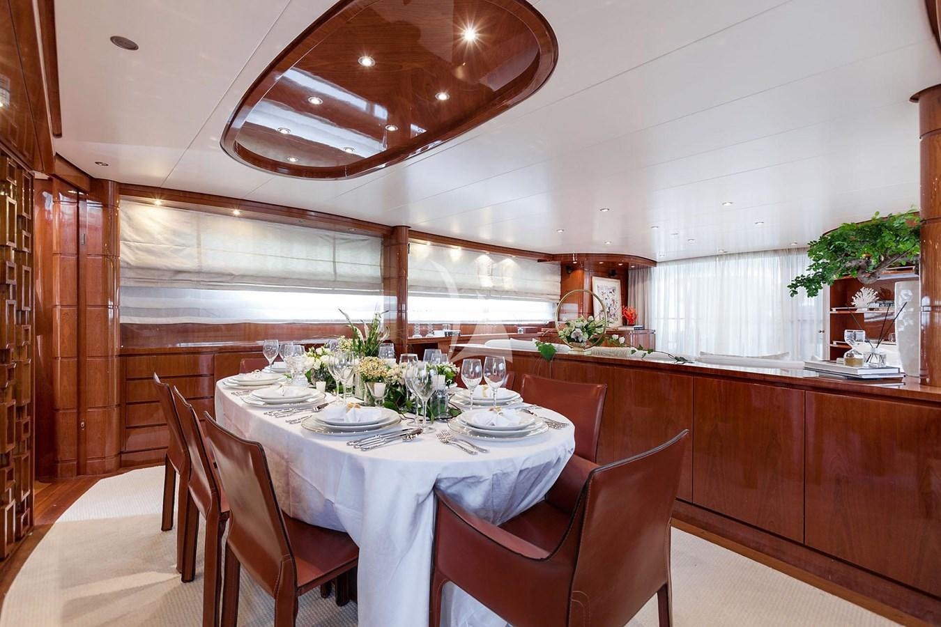 a dining room with a table and chairs aboard SL88 Yacht for Sale