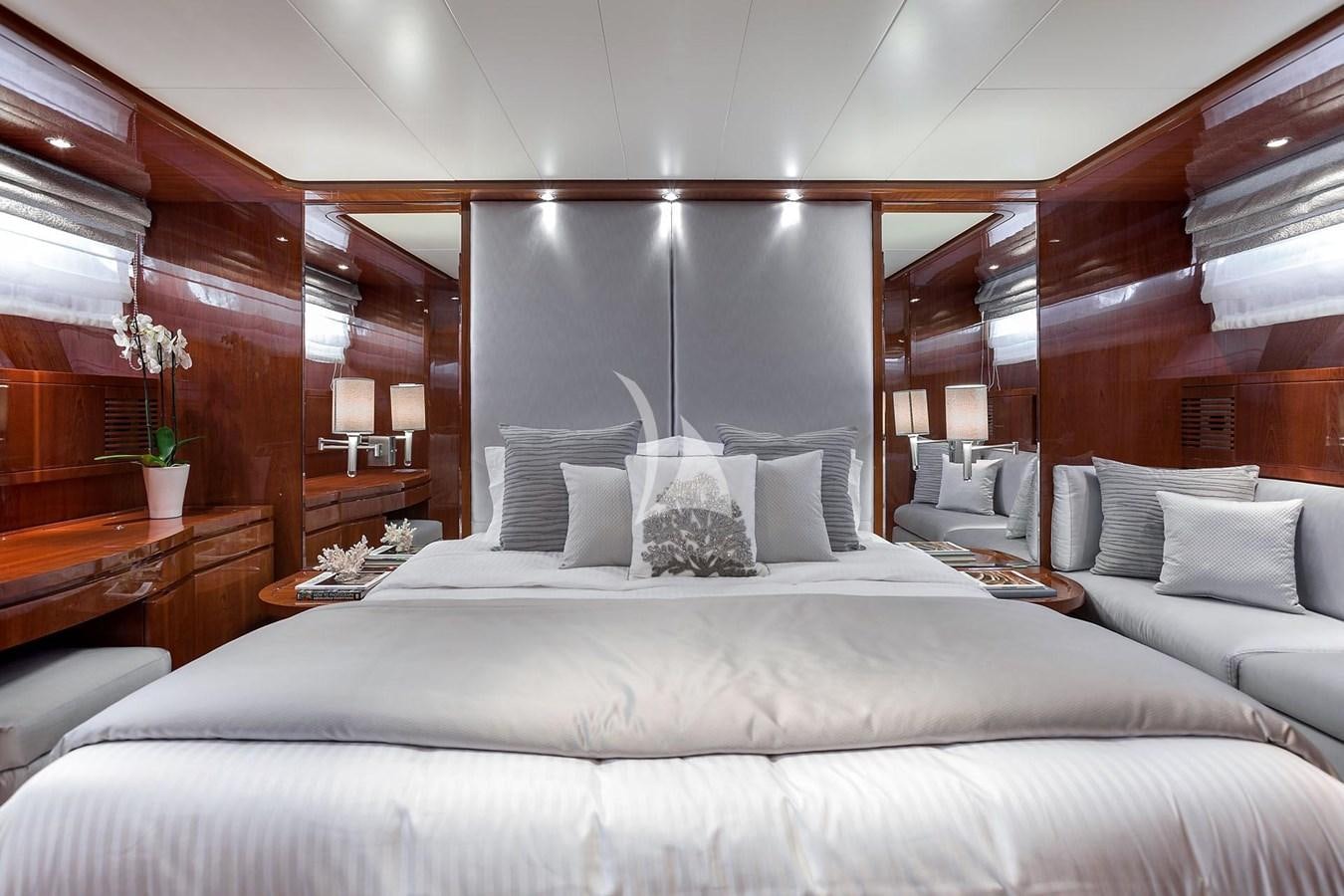 a bed with a white bed spread aboard SL88 Yacht for Sale