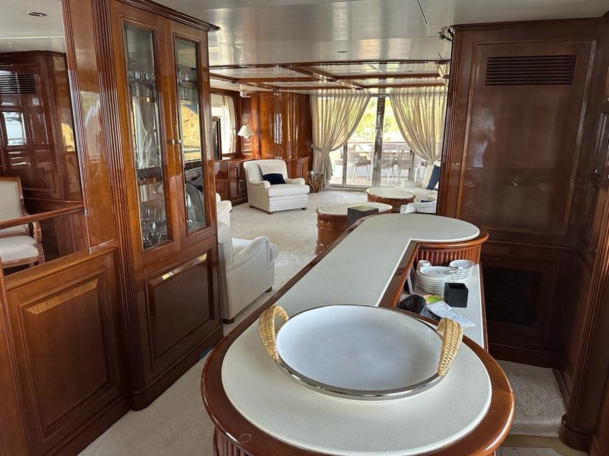 a room with a table and chairs aboard FRIENDSHIP Yacht for Sale