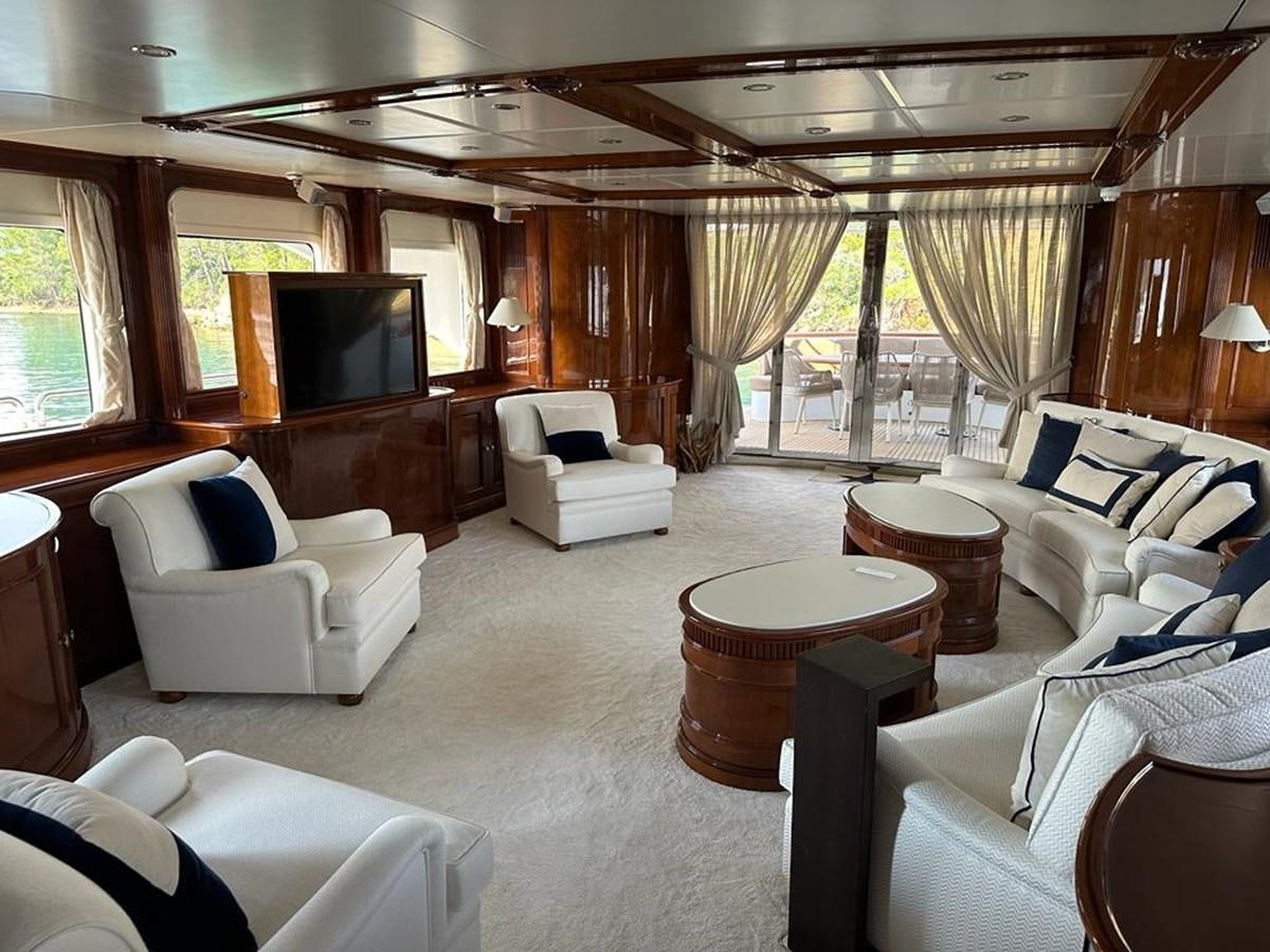 a living room with a large wood ceiling and a large television aboard FRIENDSHIP Yacht for Sale
