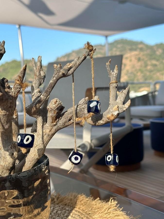 a metal sculpture of a dragon aboard FRIENDSHIP Yacht for Sale