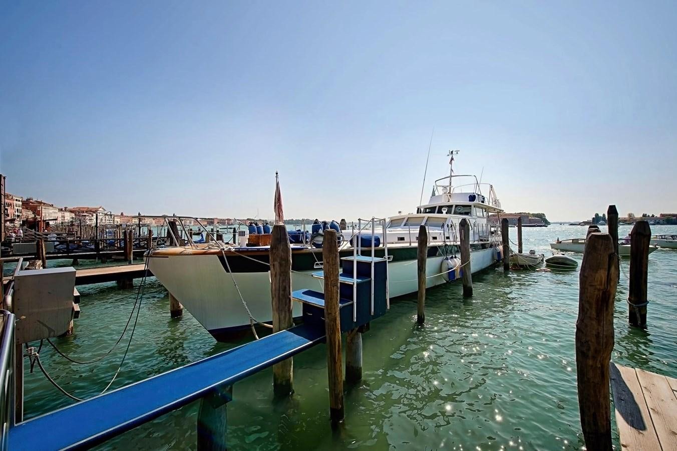 a boat docked at a pier aboard LA BOUFFONNE Yacht for Sale
