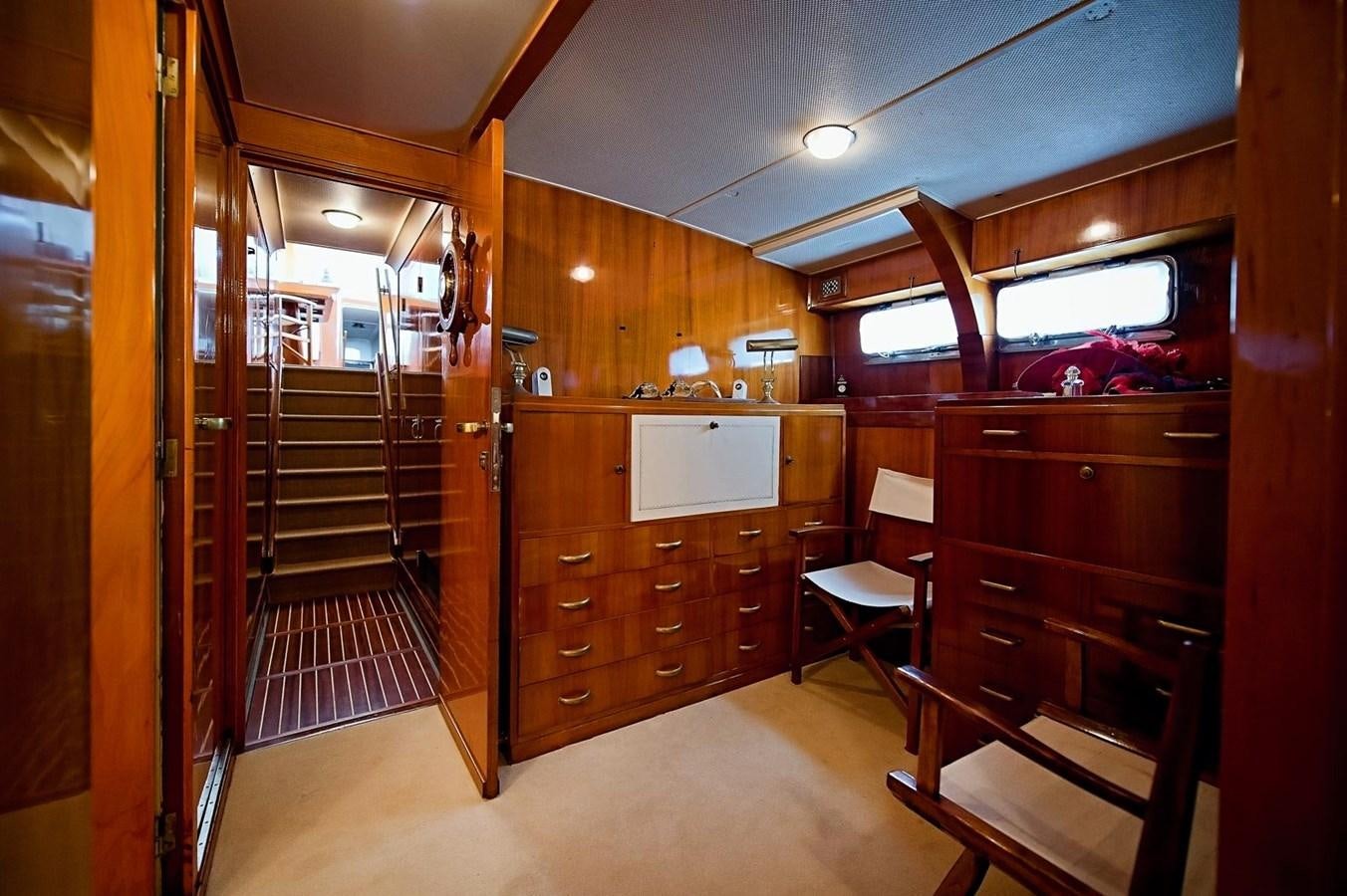 a room with wooden cabinets aboard LA BOUFFONNE Yacht for Sale
