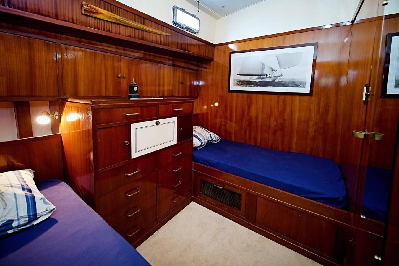 a room with wooden furniture aboard LA BOUFFONNE Yacht for Sale