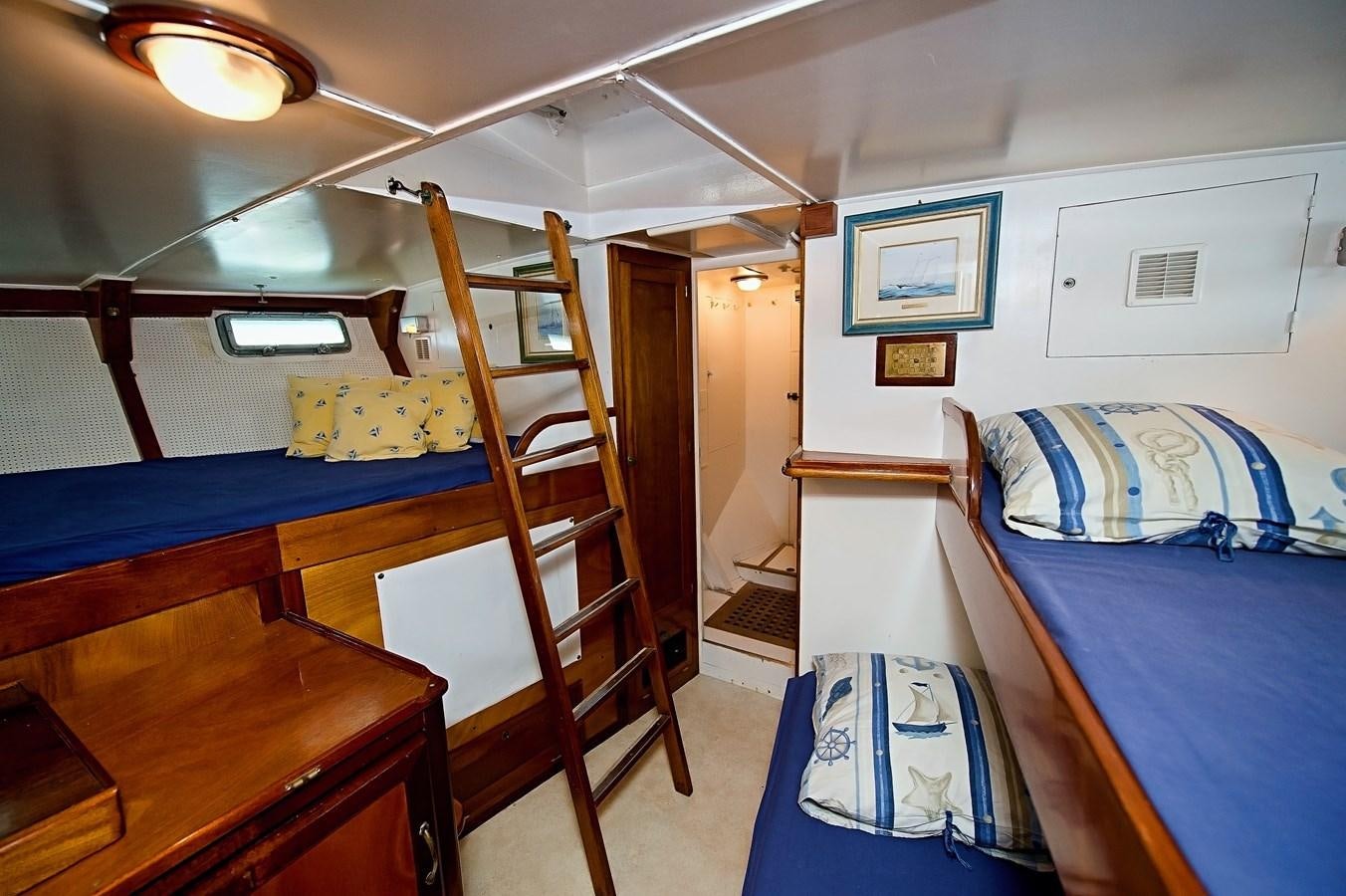 a bunk bed with a ladder aboard LA BOUFFONNE Yacht for Sale