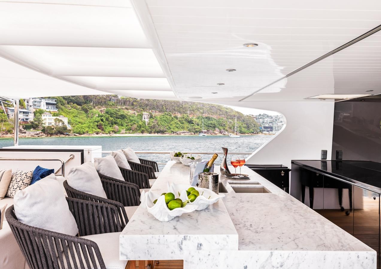 a room with a table and chairs aboard EVOLUTION 1 Yacht for Sale