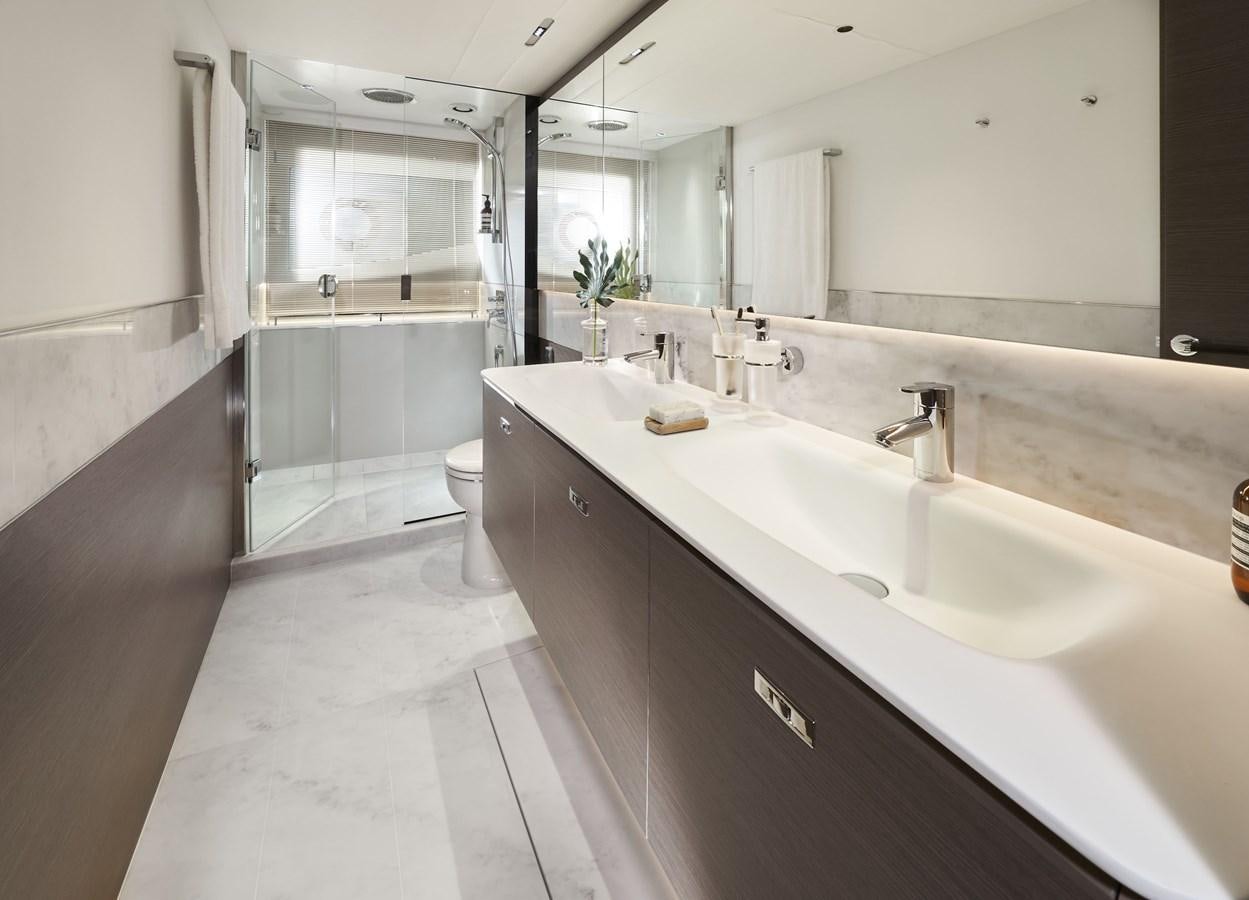 a bathroom with a large mirror aboard SPIRIT OF RIO Yacht for Sale