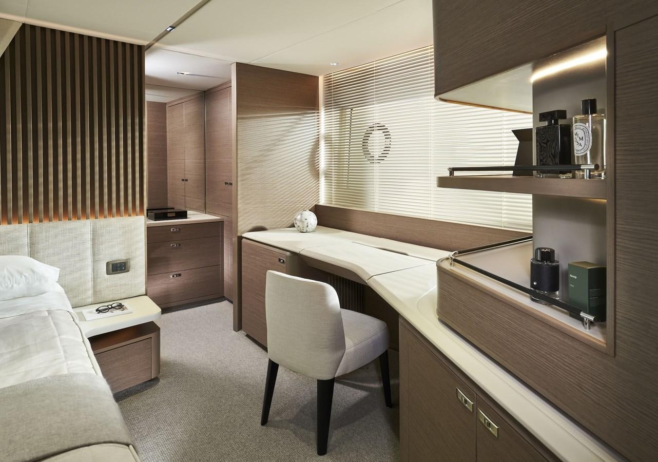 a room with a bed and a desk aboard SPIRIT OF RIO Yacht for Sale