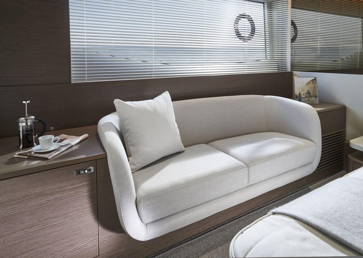 a white couch in a room aboard SPIRIT OF RIO Yacht for Sale