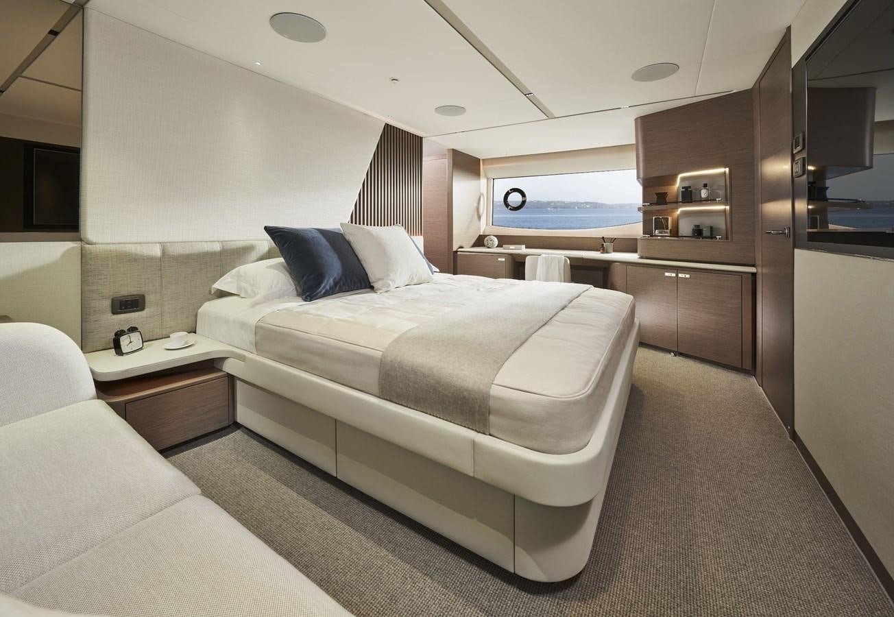 a room with a bed and a television aboard SPIRIT OF RIO Yacht for Sale