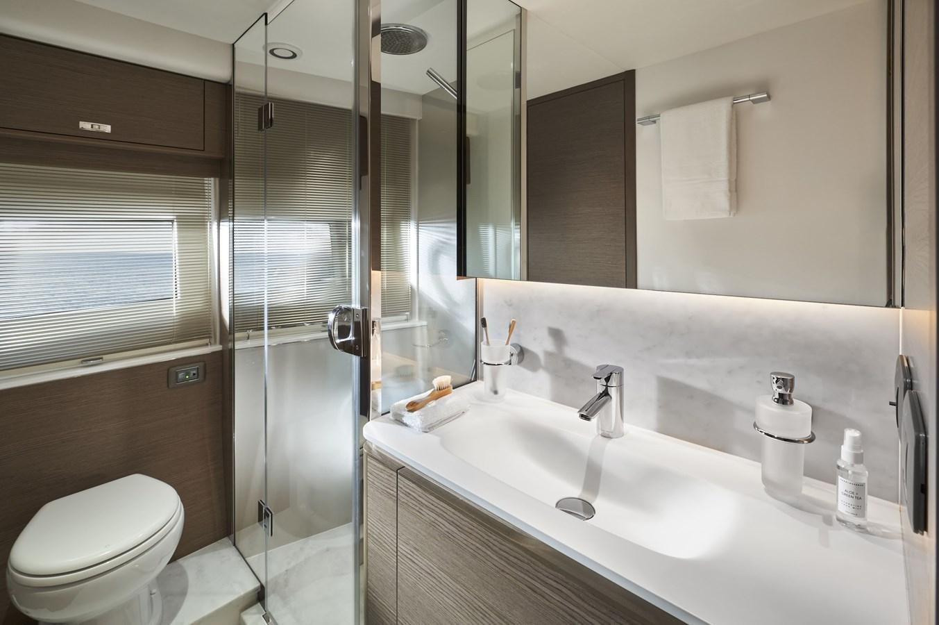 a bathroom with a glass shower aboard SPIRIT OF RIO Yacht for Sale