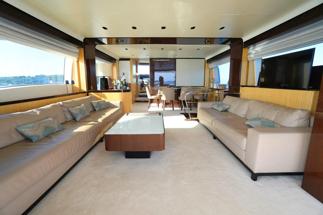The spacious salon features luxurious seating and modern decor, perfect for relaxation and entertainment. aboard HUBO Yacht for Sale