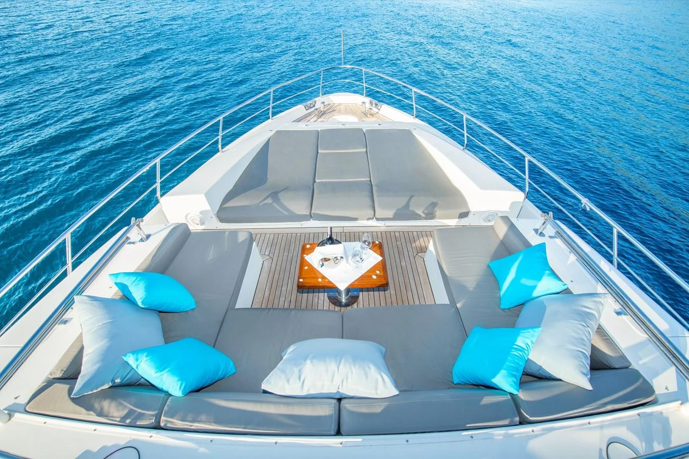 The sundeck offers a luxurious lounging area with comfortable seating and stunning ocean views. aboard HUBO Yacht for Sale