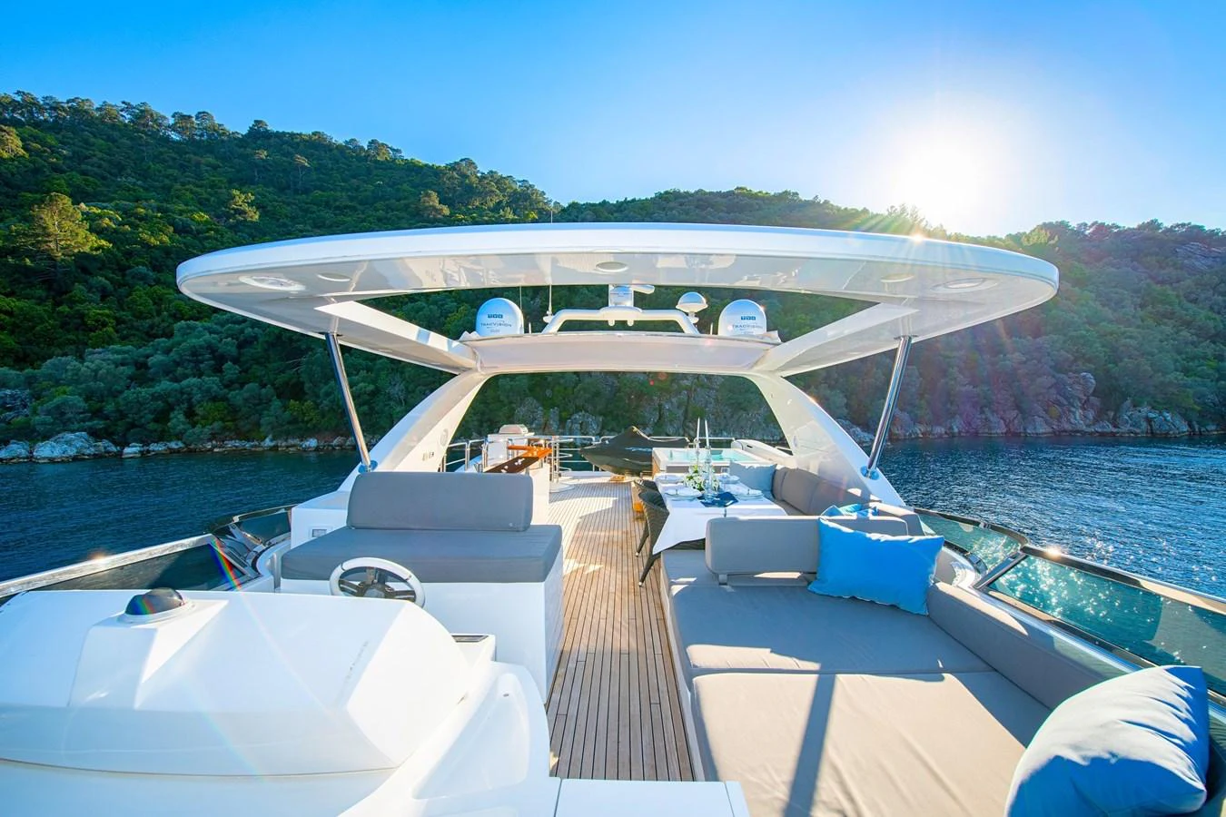 The yacht's flybridge offers a spacious and luxurious area for relaxation and socializing, with stunning views of the surrounding waters. aboard HUBO Yacht for Sale