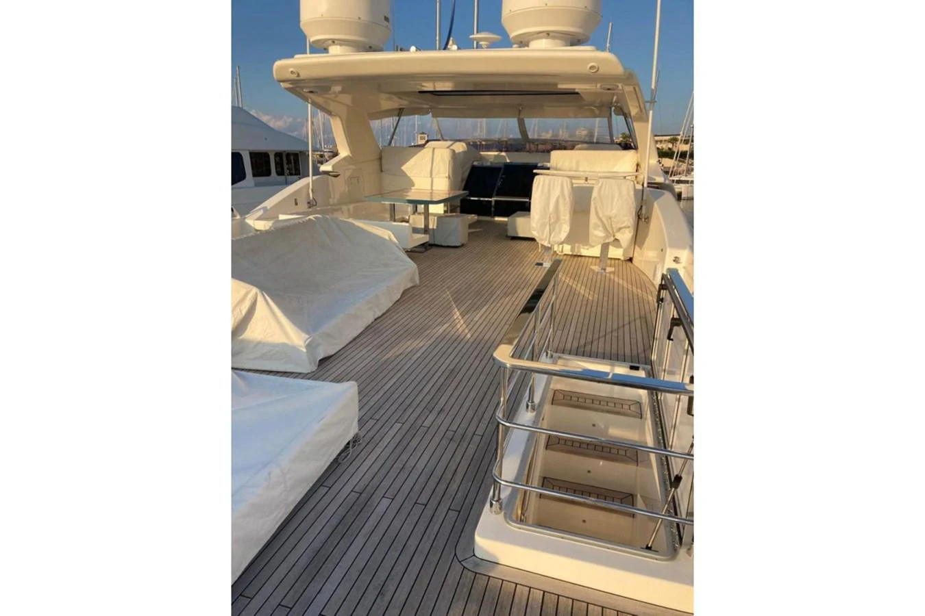 The flybridge offers a spacious and inviting area for relaxation and entertainment. aboard HAPPY 2 Yacht for Sale