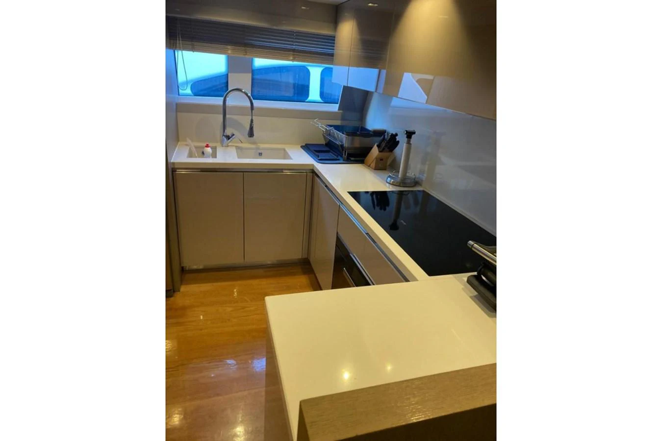 The yacht's galley features modern appliances and a sleek design, perfect for gourmet cooking. aboard HAPPY 2 Yacht for Sale