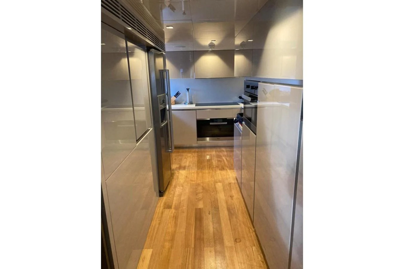 The yacht's galley features modern appliances and sleek cabinetry, providing a functional and stylish cooking space. aboard HAPPY 2 Yacht for Sale