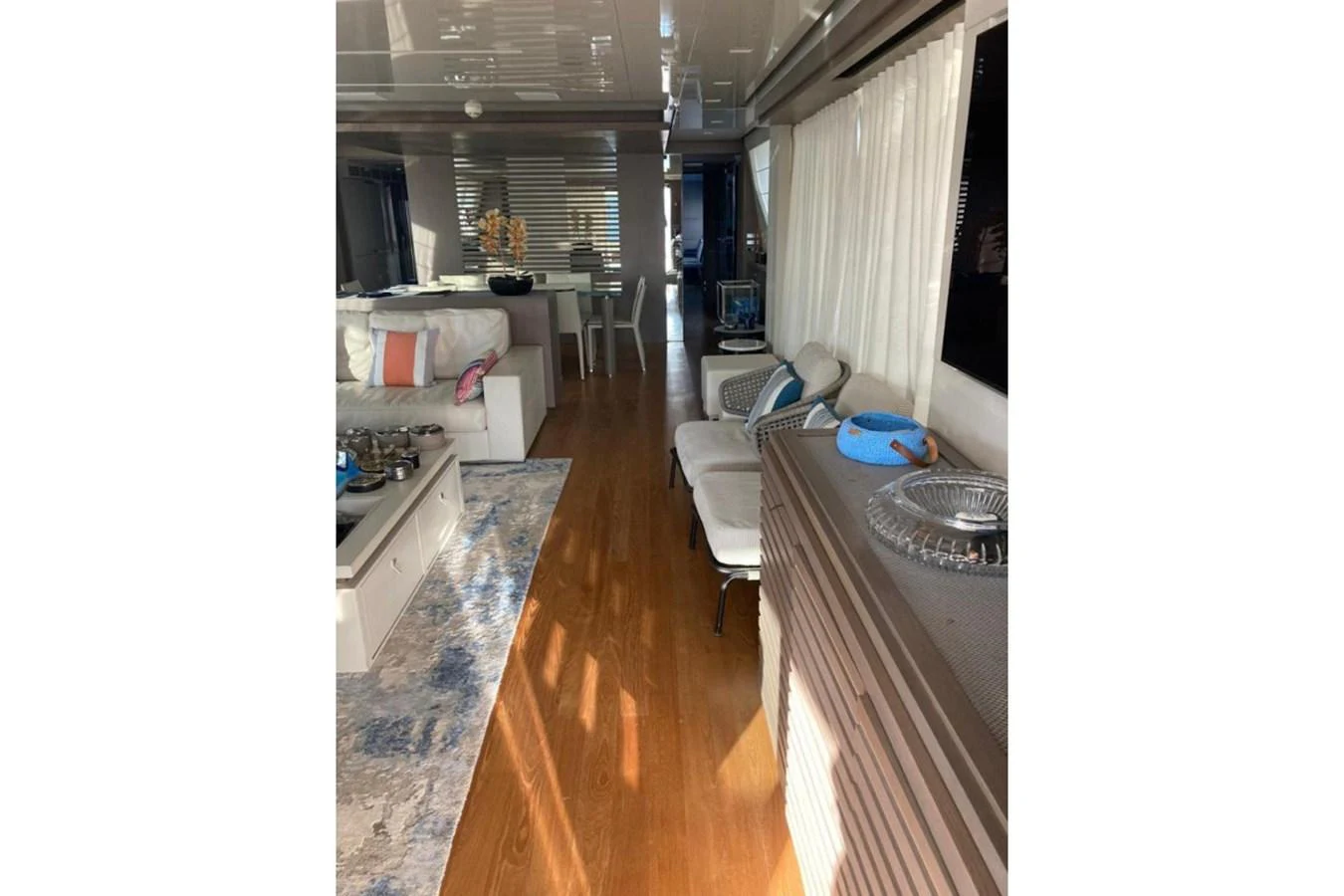 The yacht's interior features a spacious and elegantly decorated living area with comfortable seating and stylish decor. aboard HAPPY 2 Yacht for Sale
