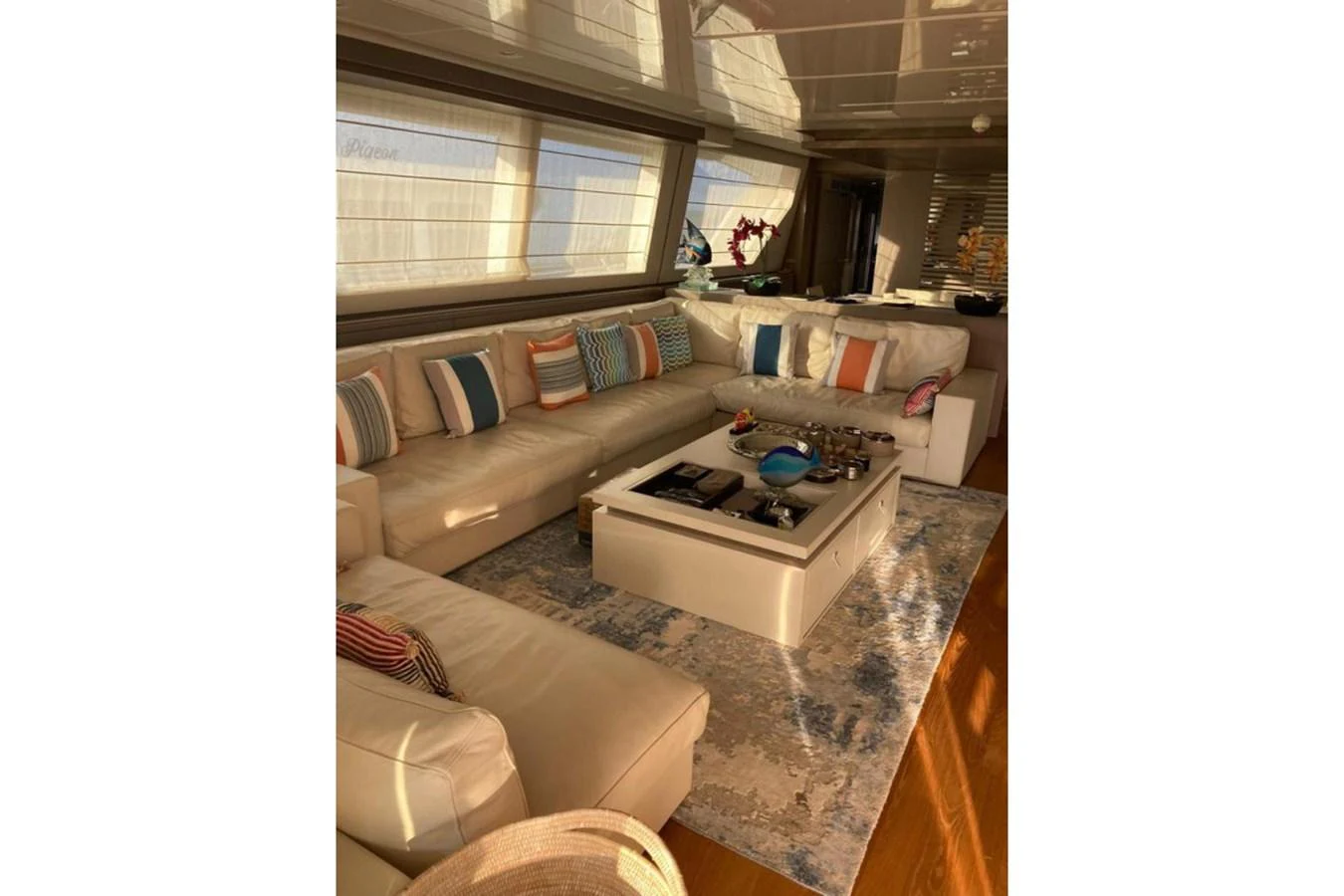 The yacht's salon features a spacious and stylish seating area with ample natural light. aboard HAPPY 2 Yacht for Sale