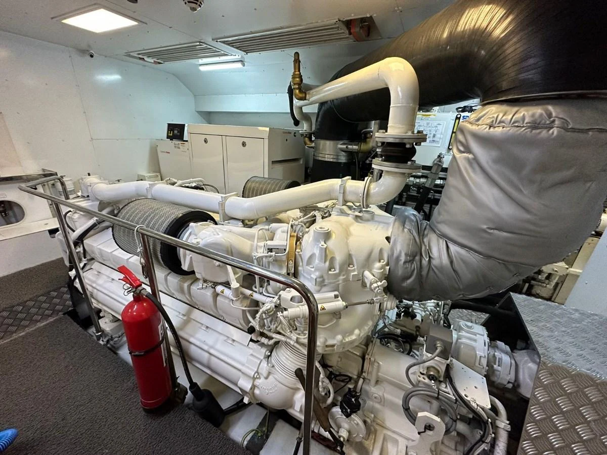 The image showcases the yacht's well-maintained engine room with advanced machinery. aboard HAPPY 2 Yacht for Sale