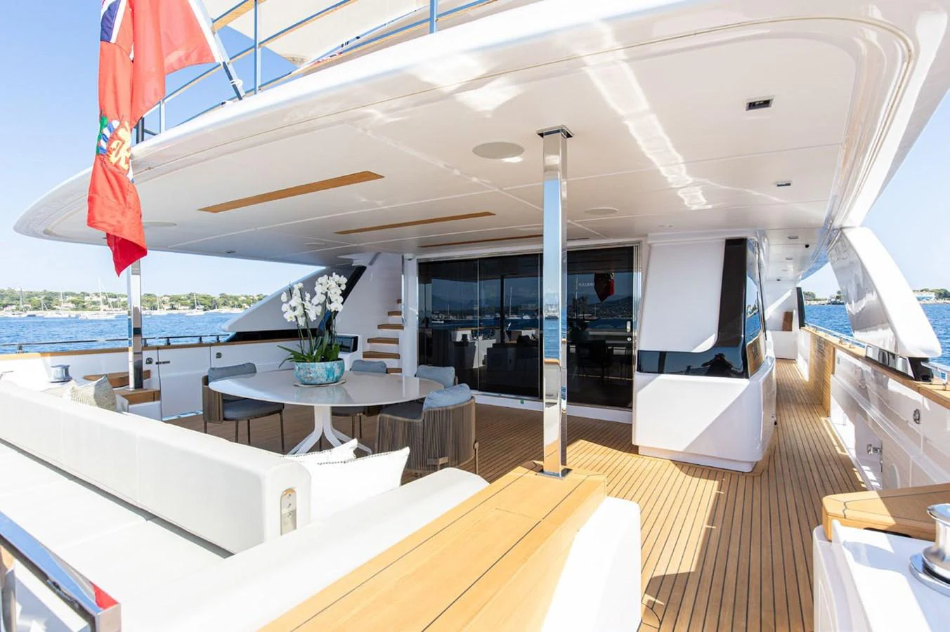 a room with a table and chairs aboard HAIAMI I Yacht for Sale