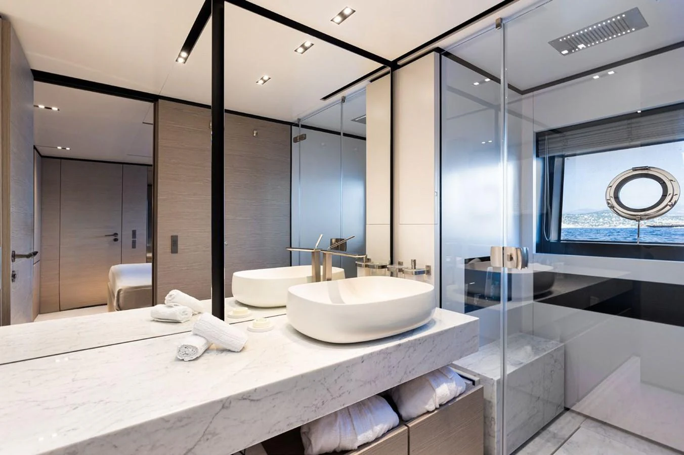 a bathroom with a large mirror aboard HAIAMI I Yacht for Sale