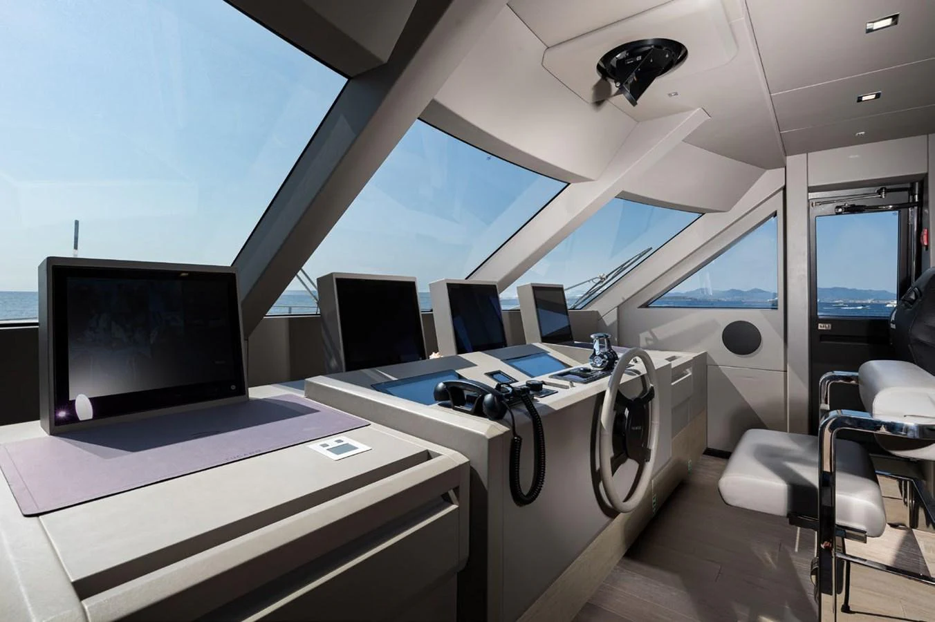a room with computers and monitors aboard HAIAMI I Yacht for Sale