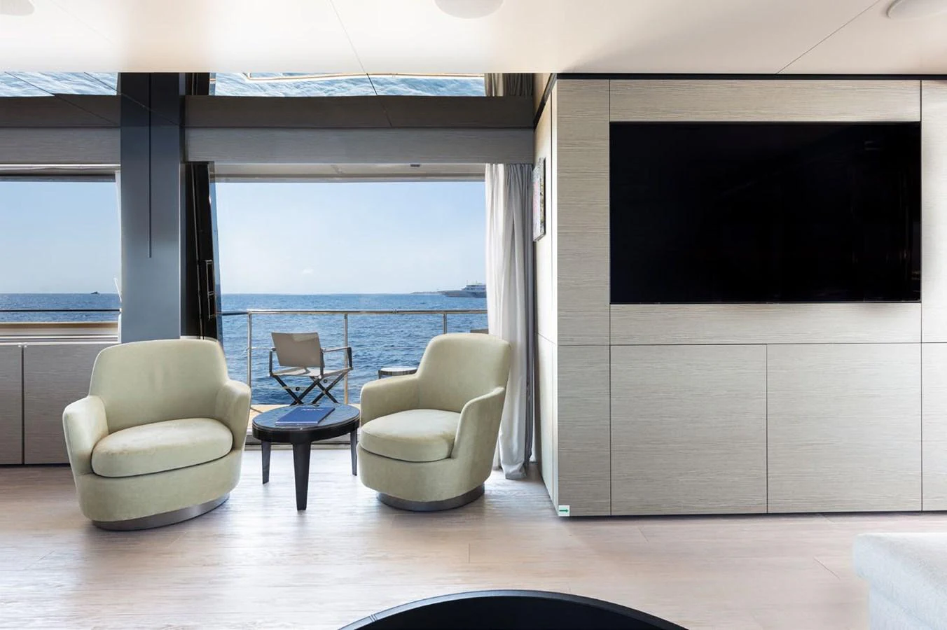 a room with a large window and a view of the ocean aboard HAIAMI I Yacht for Sale