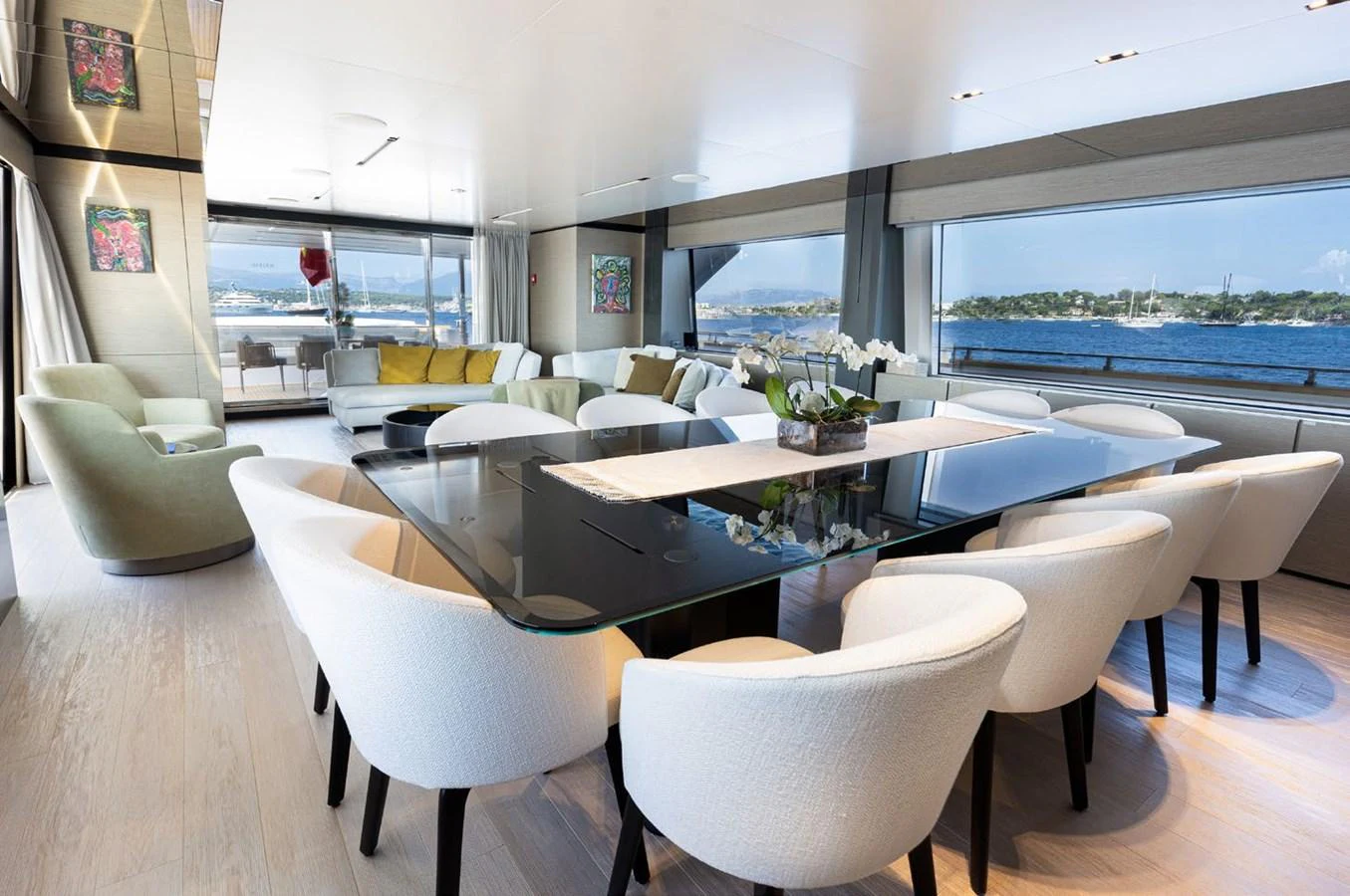 a room with a table and chairs aboard HAIAMI I Yacht for Sale