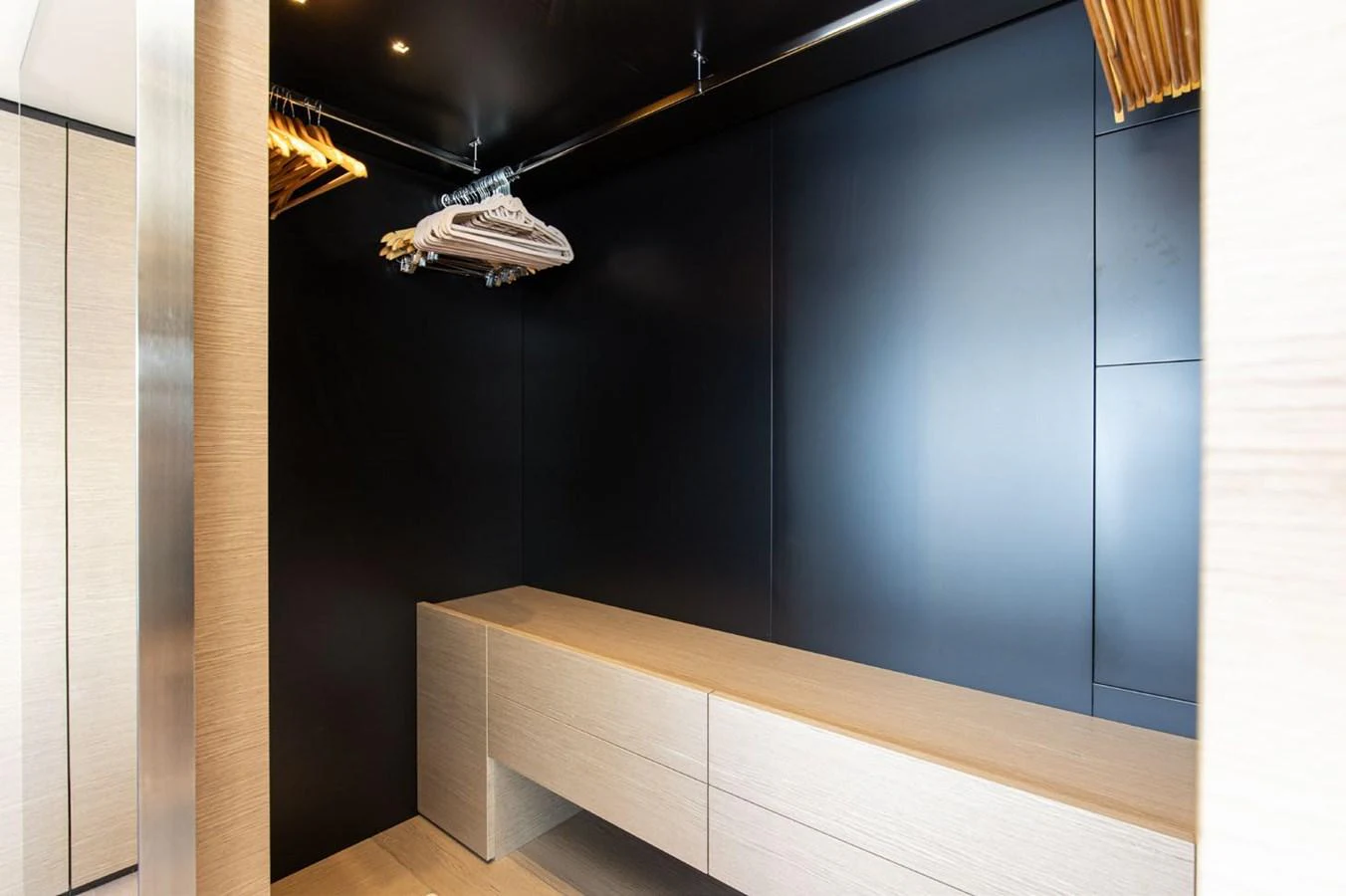 a room with a black wall and a white box on the wall aboard HAIAMI I Yacht for Sale