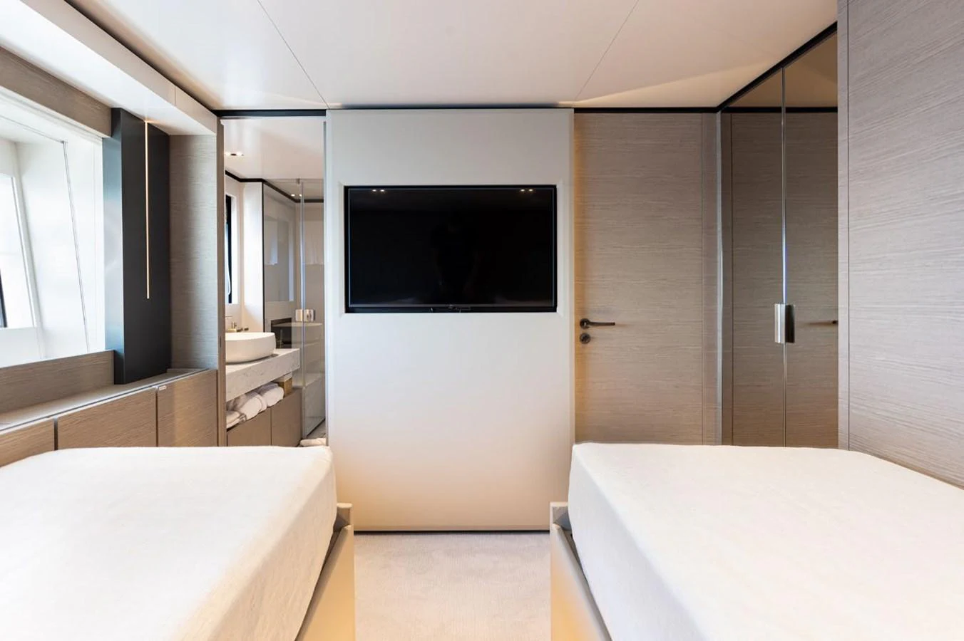 a room with a tv and a bathtub aboard HAIAMI I Yacht for Sale