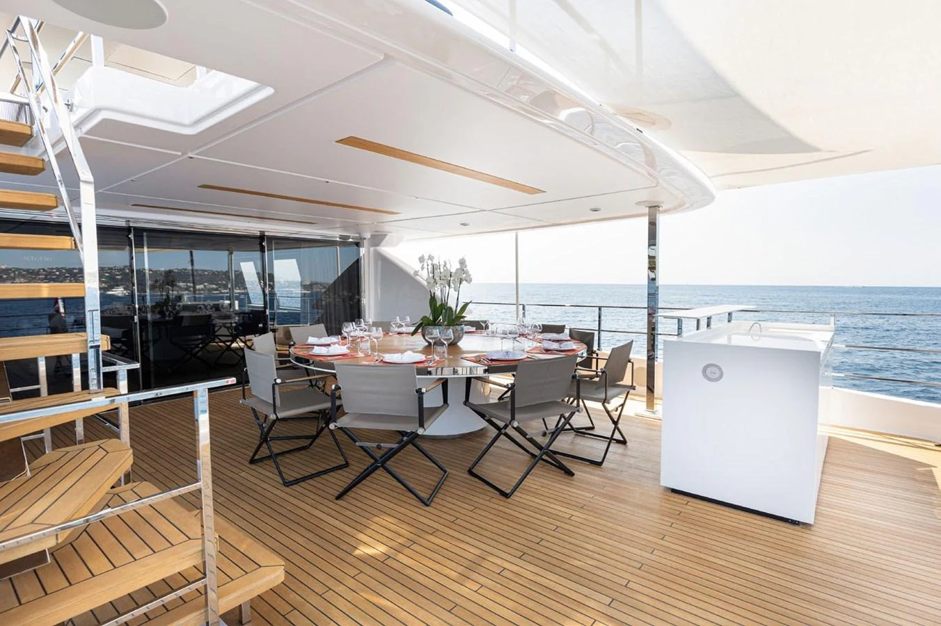 a room with a table and chairs aboard HAIAMI I Yacht for Sale