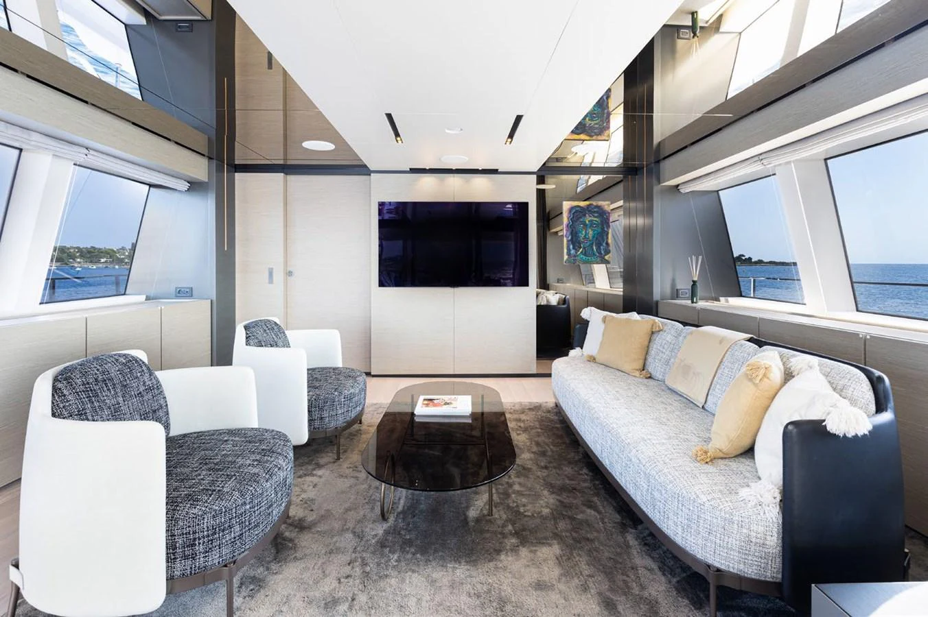 a living room with a couch and a coffee table aboard HAIAMI I Yacht for Sale
