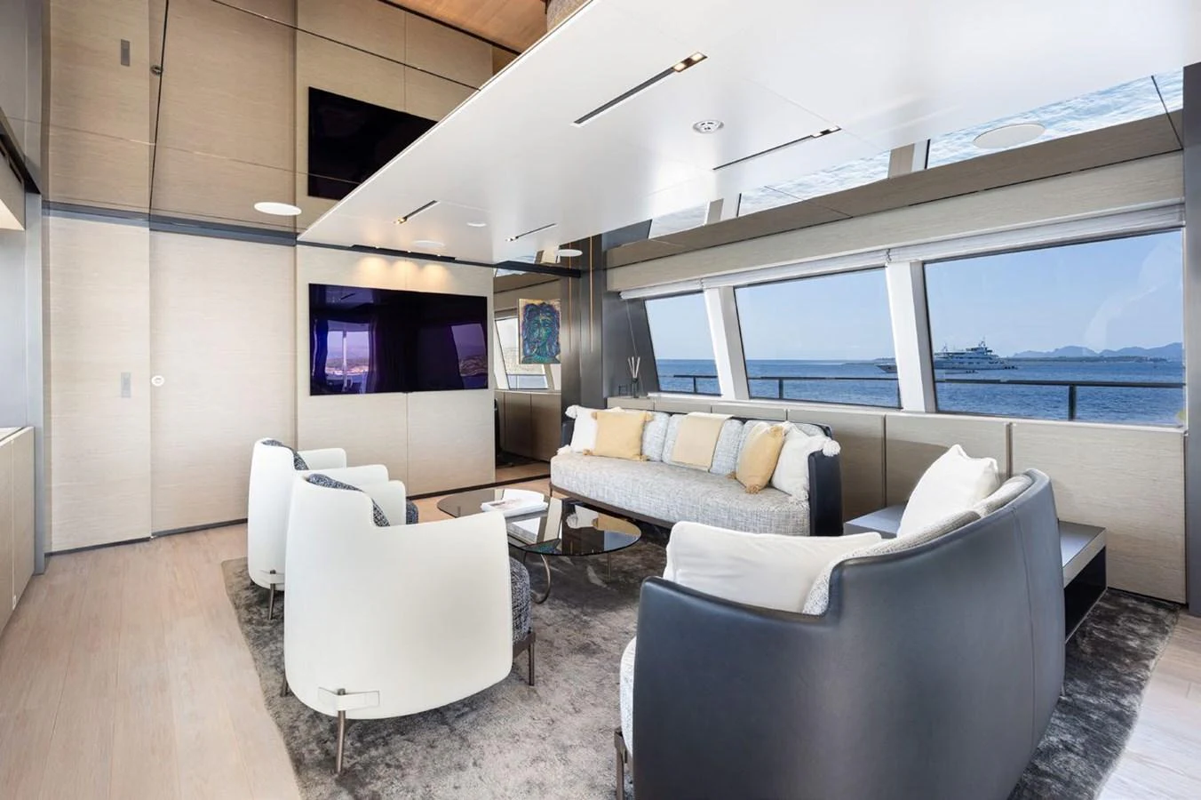 a living room with a couch and a tv aboard HAIAMI I Yacht for Sale