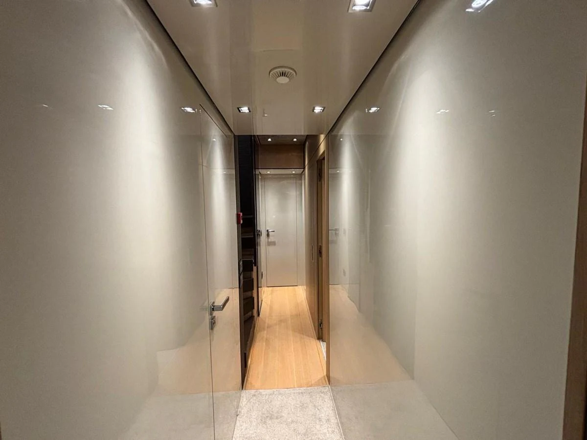 A sleek and modern hallway with glossy walls and recessed lighting. aboard SANLORENZO Yacht for Sale