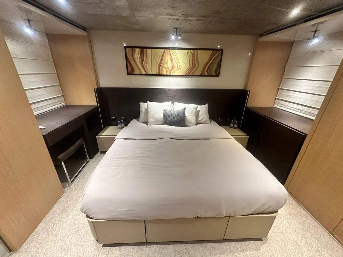 The master stateroom features a luxurious bed with elegant decor and ample storage space. aboard SANLORENZO Yacht for Sale