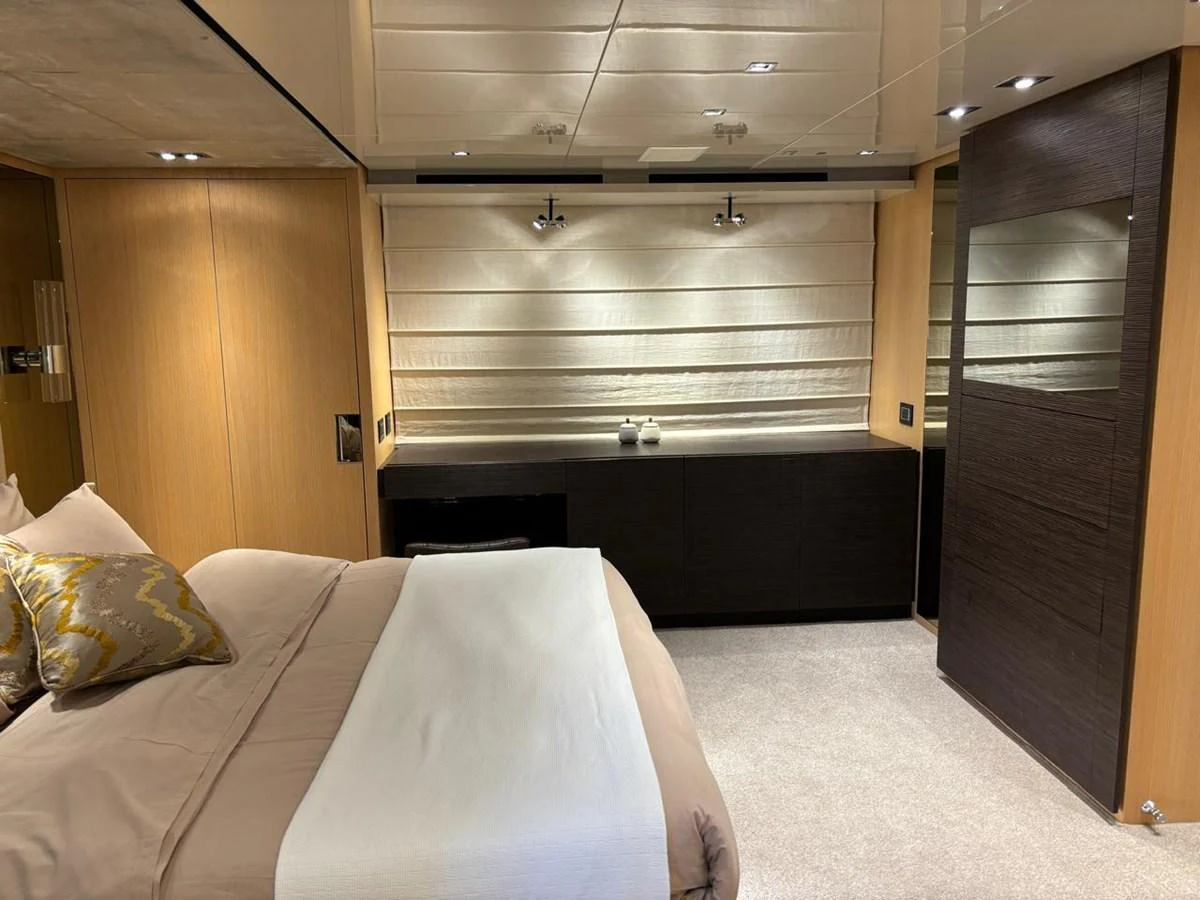 A luxurious stateroom featuring a comfortable bed and modern furnishings. aboard SANLORENZO Yacht for Sale
