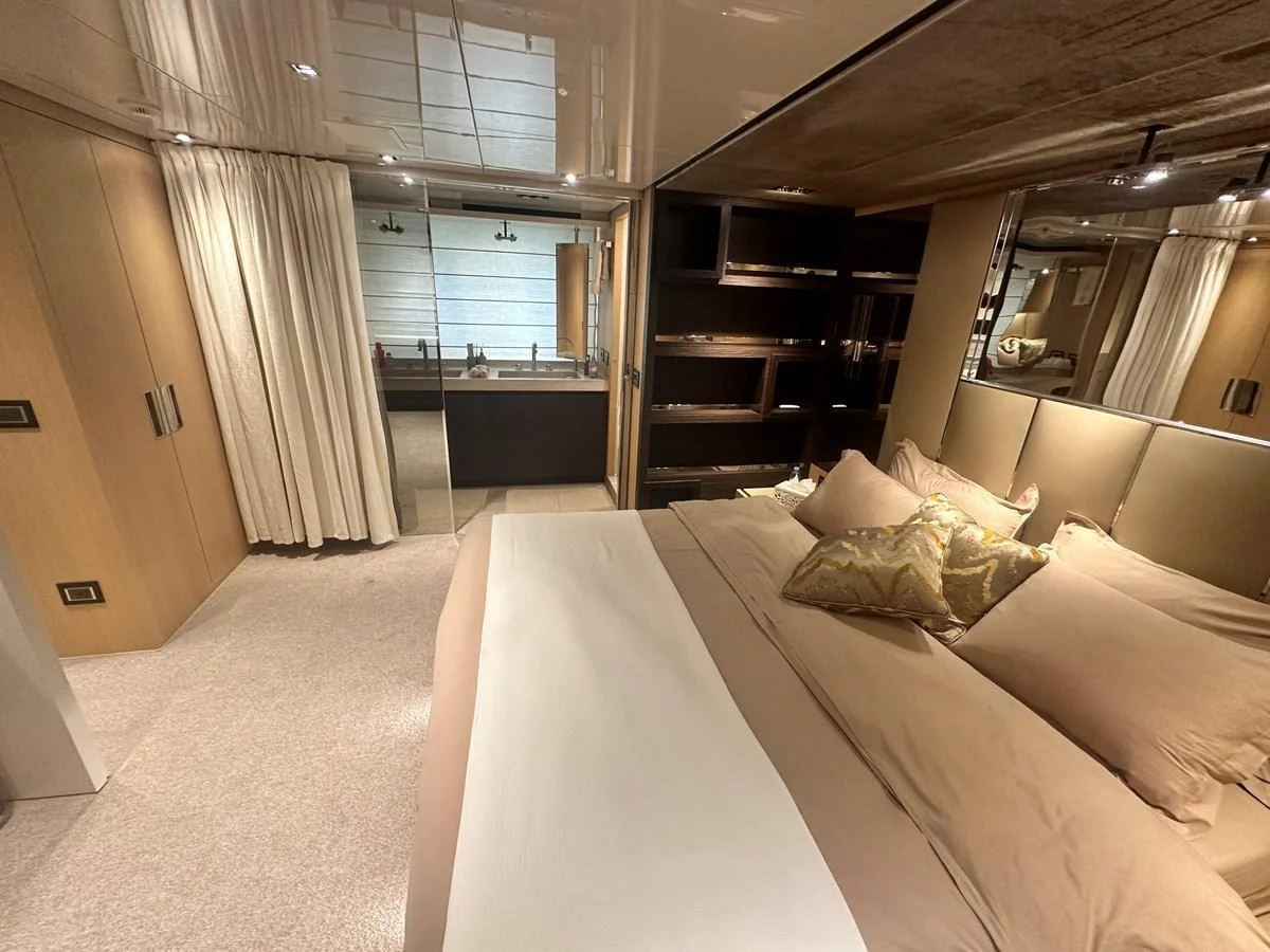 The master stateroom features a luxurious bed with elegant bedding and ample storage space. aboard SANLORENZO Yacht for Sale